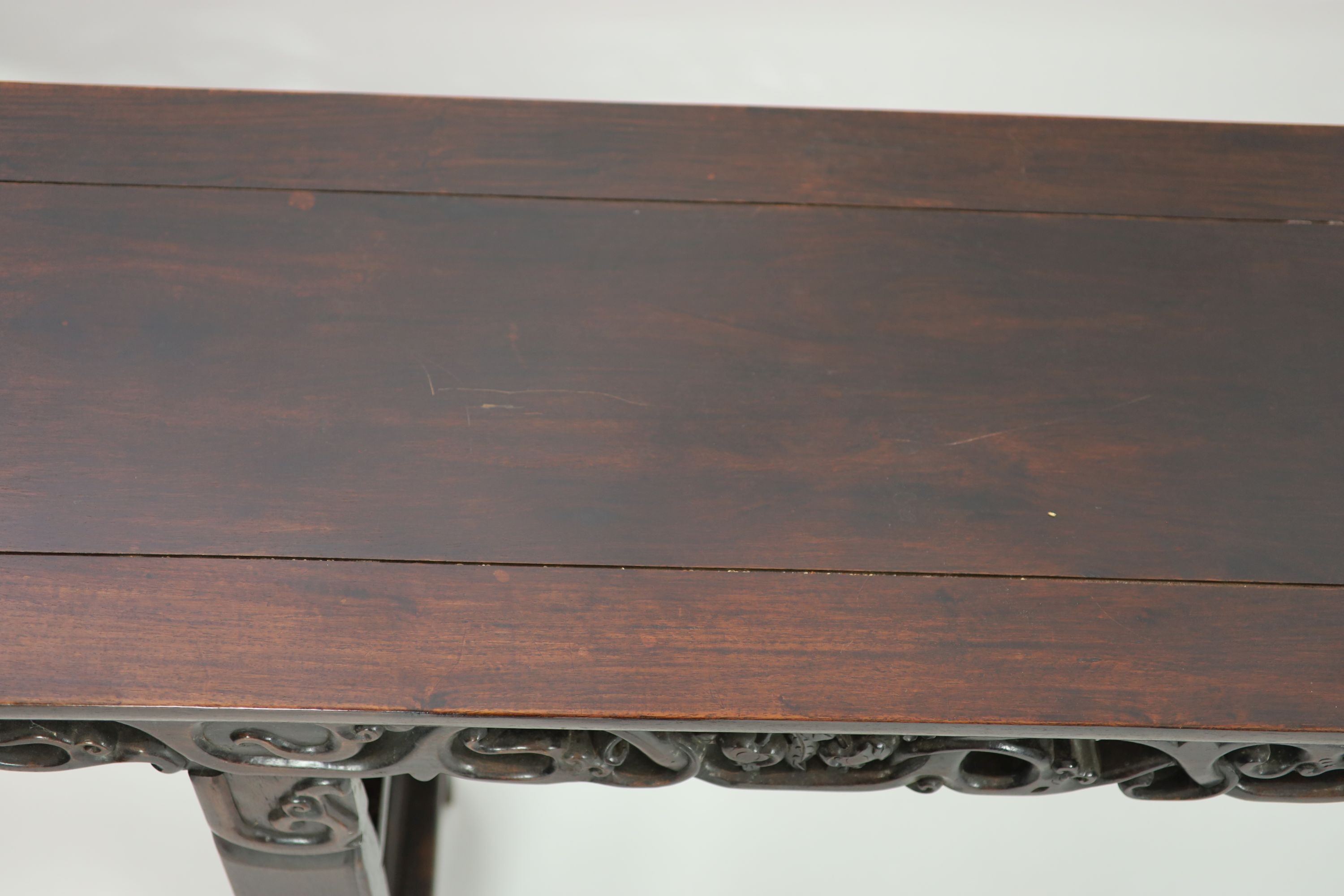 A large Chinese hongmu altar table, 19th century H 110cm. W 281cm. D 51.5cm.